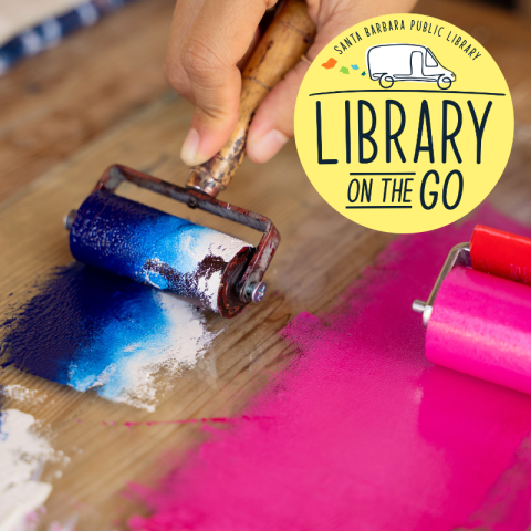 Ink roller with blue and white paint beside a second roller with pink paint, with the “Library on the Go” logo in the corner.