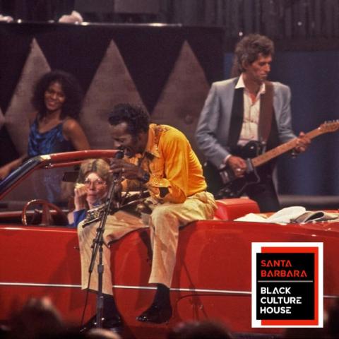 Chuck Berry singing on the back of a red car with a guitarist behind and the logo of the Santa Barbara Black Culture House in the corner.