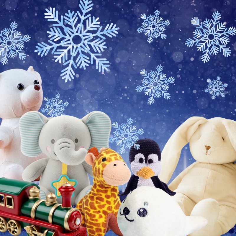 Stuffed animals and a train in front of a background of falling snowflakes