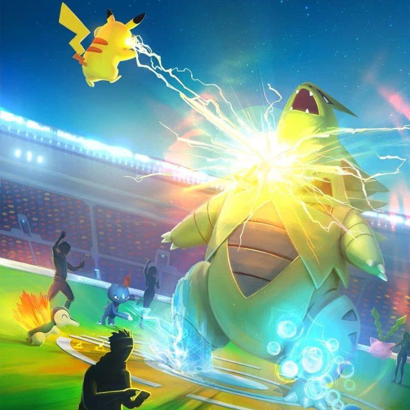 Illustration of Pikachu using a lightning attack against Tyranitar during a battle.